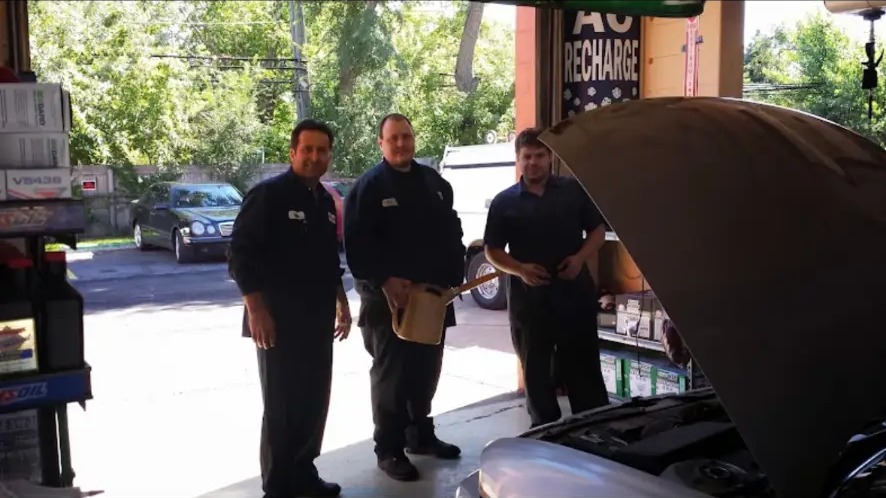 The Castrol Quick Lube crew at the garage door